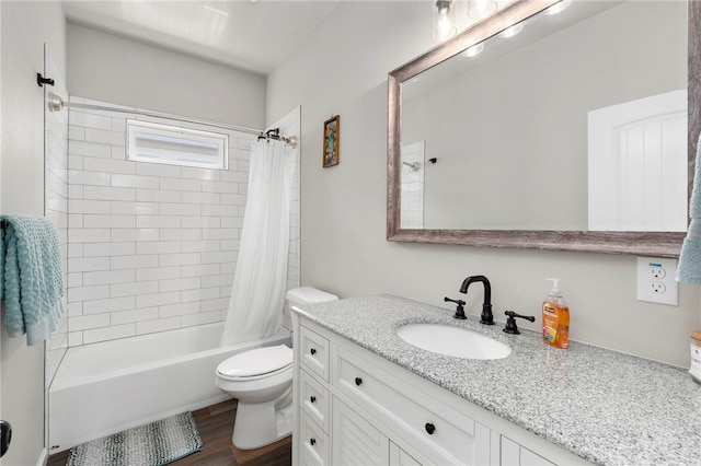 964 Allende St, Seguin, TX 78155 - bathroom featuring toilet, vanity, wood finished floors, and shower / bathtub combination with curtain
