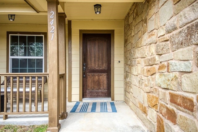 2421 Country Oaks Cir, Ingleside, TX 78362 - property entrance with stone siding and covered porch