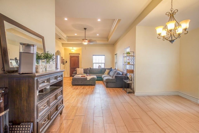 2421 Country Oaks Cir, Ingleside, TX 78362 - living room with crown molding, recessed lighting, a raised ceiling, and light wood-style floors