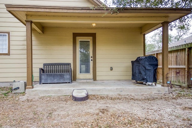 2421 Country Oaks Cir, Ingleside, TX 78362 - doorway to property featuring a patio area and fence