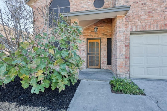 doorway to property featuring a garage