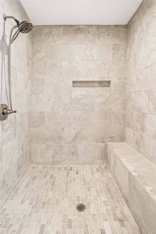 bathroom with a tile shower
