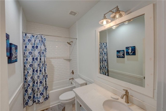 129 N Alister St Unit 2, Port Aransas, TX 78373 - bathroom featuring toilet, vanity, and shower / bathtub combination with curtain