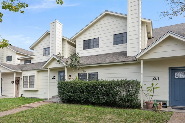 view of front of house with a front lawn