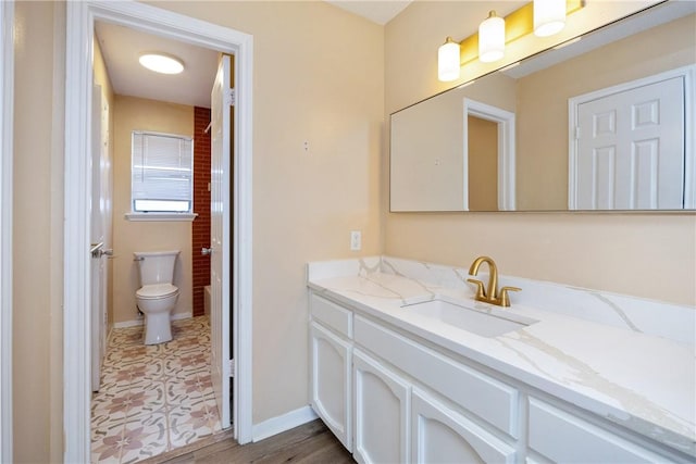 bathroom featuring hardwood / wood-style flooring, vanity, and toilet