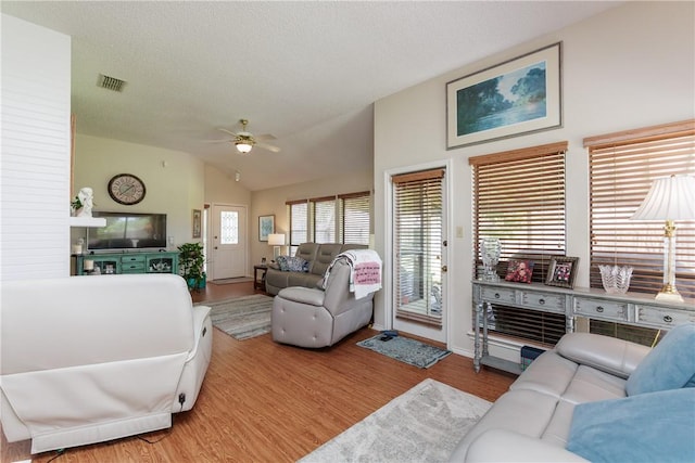 7153 Brookedge Ln, Corpus Christi, TX 78414 - living area with vaulted ceiling, wood finished floors, and a ceiling fan