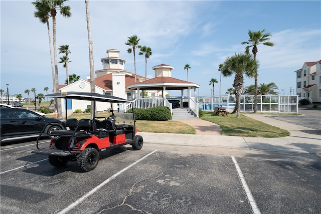 view of car parking featuring a gazebo