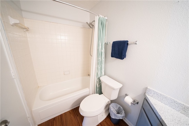 full bathroom featuring hardwood / wood-style floors, vanity, shower / bathtub combination with curtain, and toilet