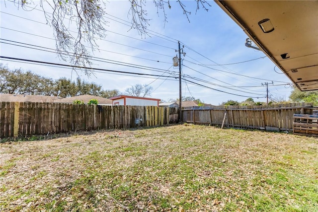 view of yard with a fenced backyard