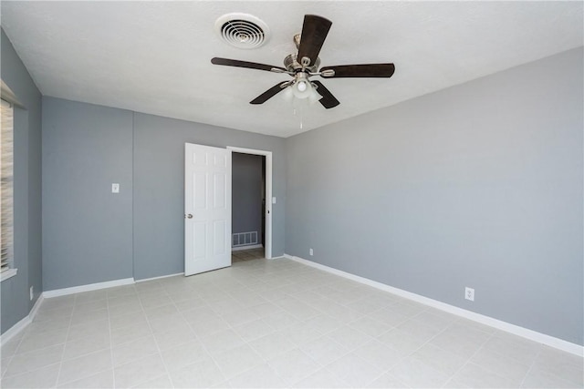 unfurnished bedroom featuring visible vents, a ceiling fan, and baseboards