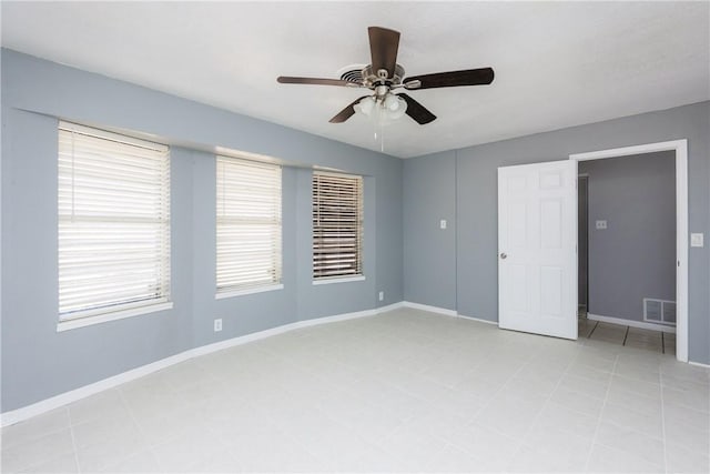 unfurnished bedroom featuring visible vents, a ceiling fan, and baseboards