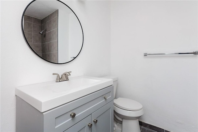 bathroom with toilet and vanity