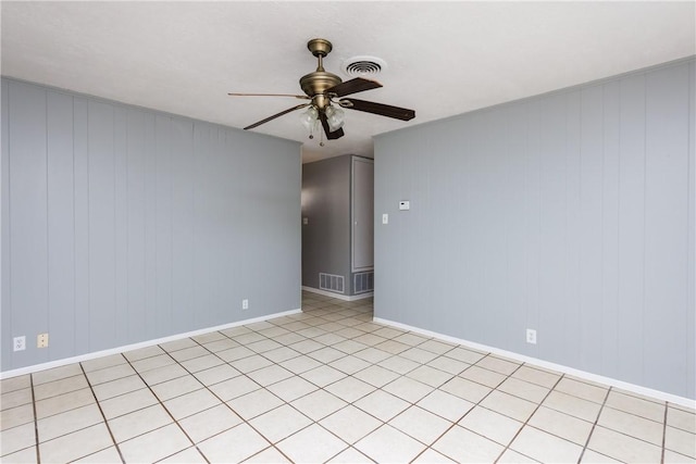 unfurnished room featuring visible vents, baseboards, and ceiling fan