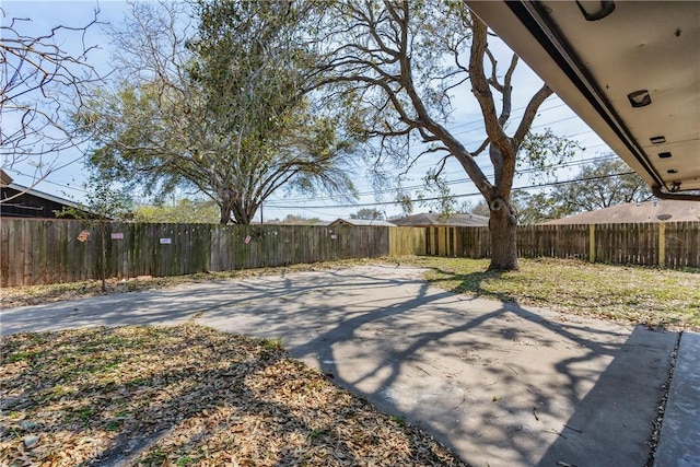 view of yard featuring a fenced backyard and a patio area