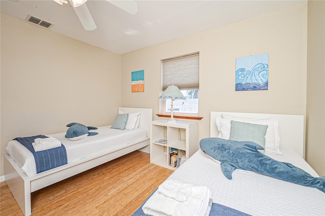 bedroom featuring wood-type flooring and ceiling fan