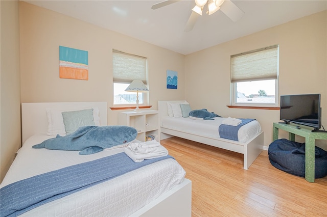 bedroom featuring wood-type flooring and ceiling fan