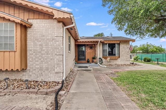 1032 Illinois St, Robstown, TX 78380 - property entrance with board and batten siding and brick siding