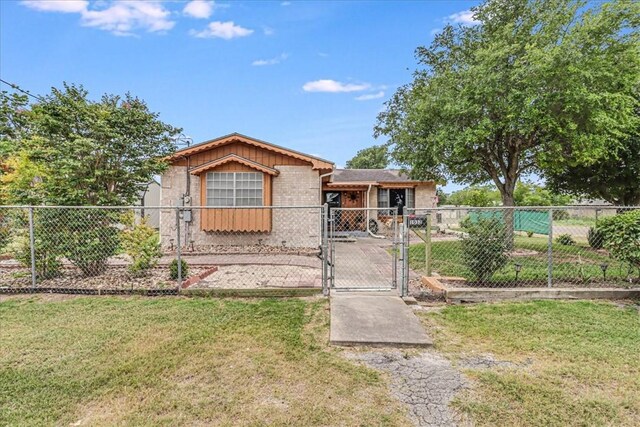 1032 Illinois St, Robstown, TX 78380 - view of front of property with a gate and brick siding