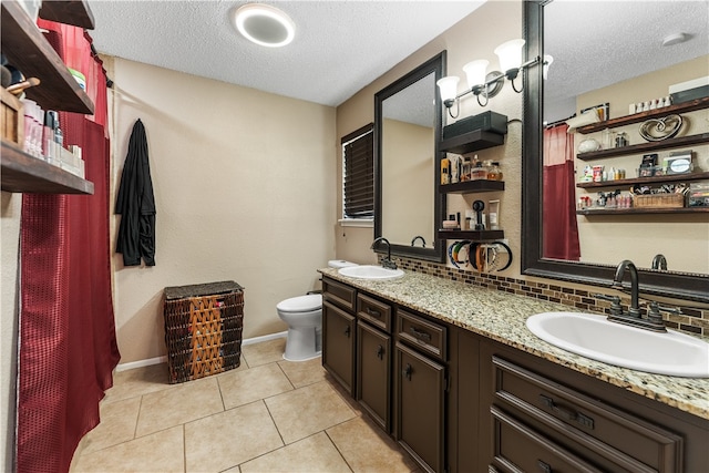 bathroom featuring toilet, tile patterned floors, a textured ceiling, and tasteful backsplash