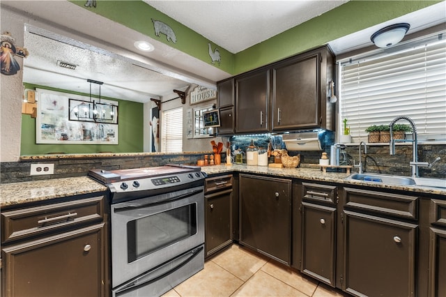 kitchen featuring dark brown cabinets, sink, stainless steel range with electric stovetop, and a textured ceiling