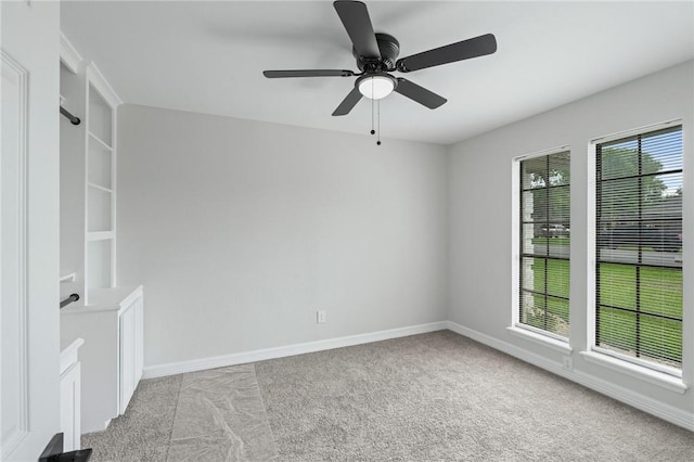6726 Hunt Dr, Corpus Christi, TX 78413 - unfurnished room featuring light colored carpet, baseboards, and a ceiling fan