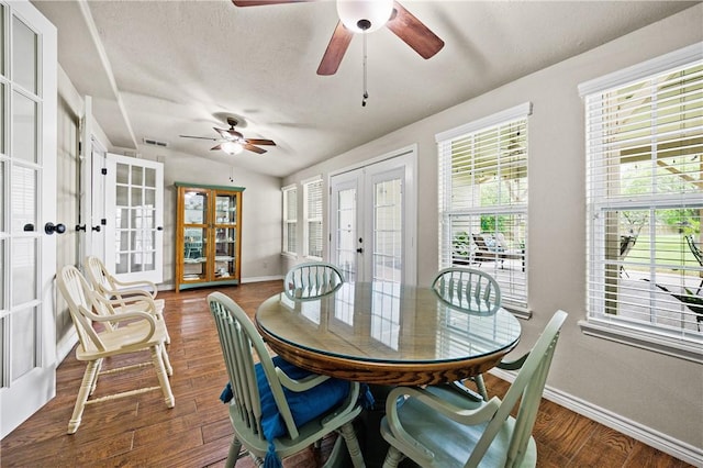 sunroom / solarium featuring visible vents, plenty of natural light, and french doors