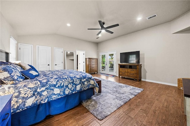 bedroom with visible vents, lofted ceiling, wood finished floors, access to exterior, and french doors