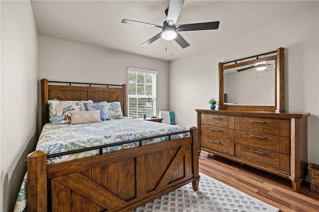 bedroom featuring a ceiling fan and wood finished floors