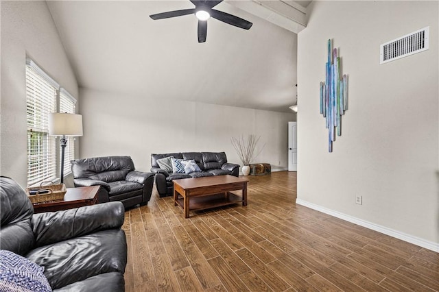 living area featuring visible vents, a ceiling fan, lofted ceiling, and wood finished floors