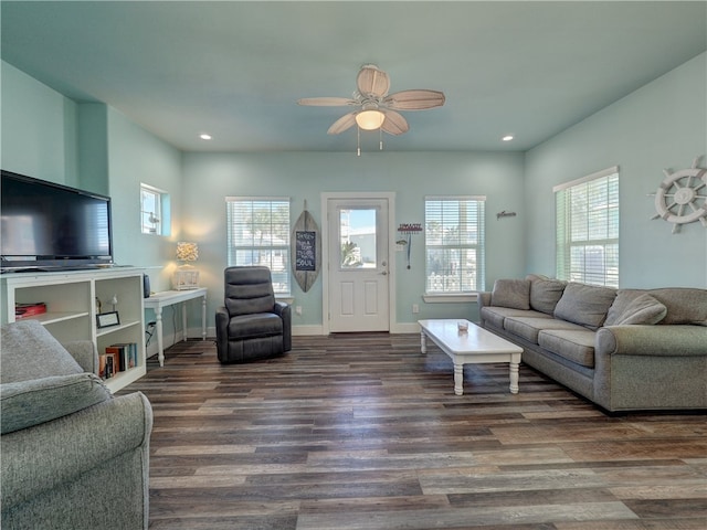 living room with ceiling fan and dark hardwood / wood-style floors