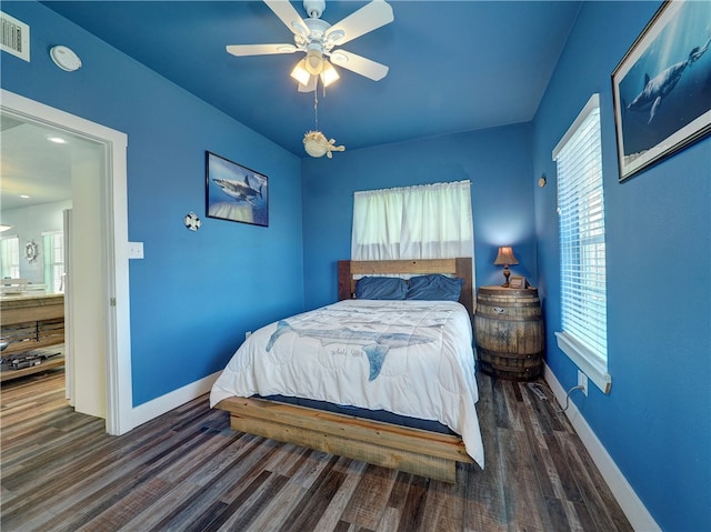 bedroom featuring dark wood-type flooring and ceiling fan