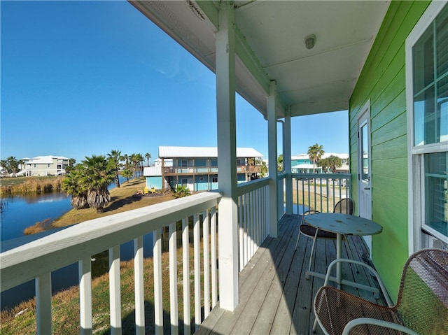 balcony featuring a water view