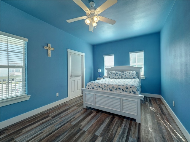 bedroom featuring dark hardwood / wood-style flooring and ceiling fan