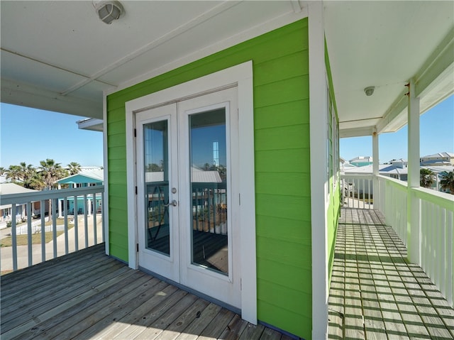 wooden deck featuring french doors