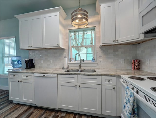 kitchen featuring white appliances, white cabinetry, sink, and a wealth of natural light