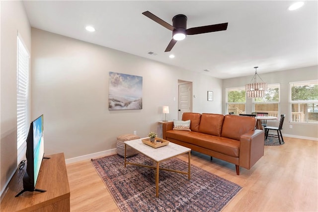 1233 Brentwood Dr, Corpus Christi, TX 78404 - living room featuring light wood-style floors, baseboards, a chandelier, a ceiling fan, and recessed lighting