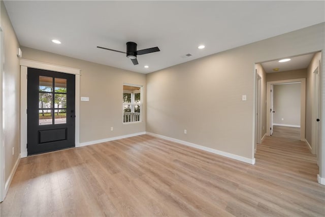 unfurnished room with ceiling fan and light hardwood / wood-style floors