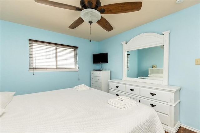 bedroom with wood-type flooring and ceiling fan