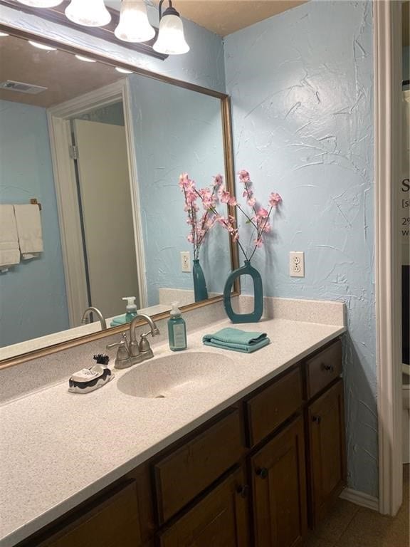 bathroom with tile patterned flooring and vanity