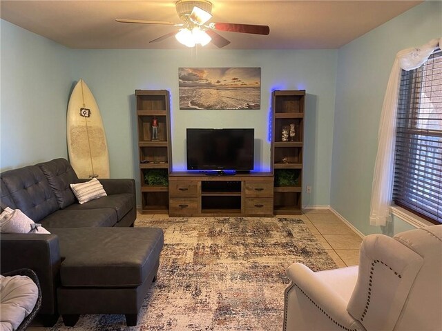 living room featuring ceiling fan and light tile patterned floors