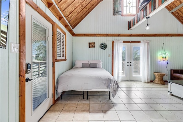 bedroom featuring french doors, light tile patterned floors, wooden walls, lofted ceiling, and wooden ceiling