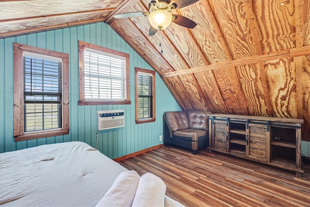 bedroom with dark wood-type flooring, wood walls, vaulted ceiling, and ceiling fan