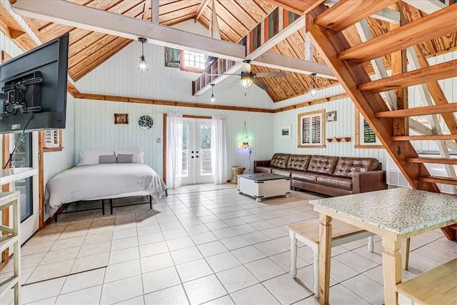 bedroom featuring beamed ceiling, high vaulted ceiling, light tile patterned floors, and french doors