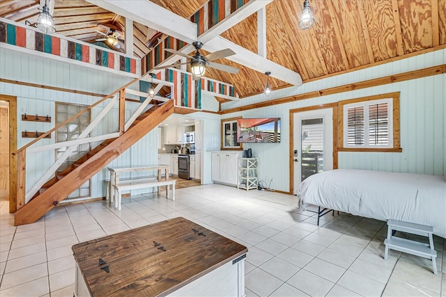 tiled bedroom with high vaulted ceiling, wood walls, and beamed ceiling