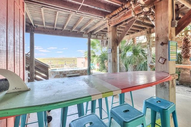 view of patio / terrace featuring an outdoor bar