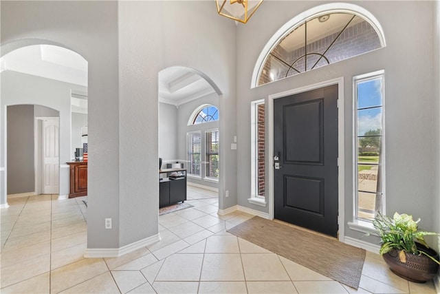 4518 Mars Hill Dr, Corpus Christi, TX 78413 - foyer featuring light tile patterned floors, a towering ceiling, and arched walkways