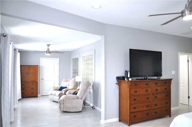 bedroom featuring ceiling fan and light hardwood / wood-style flooring