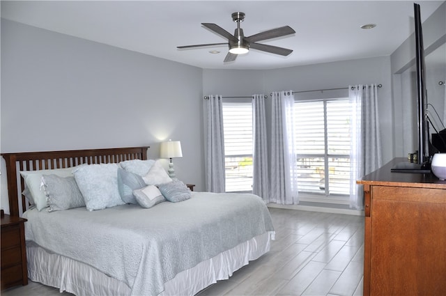 bedroom featuring ceiling fan and light wood-type flooring