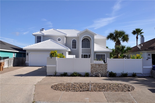 mediterranean / spanish-style house featuring a garage