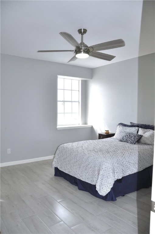 bedroom featuring ceiling fan and light hardwood / wood-style flooring